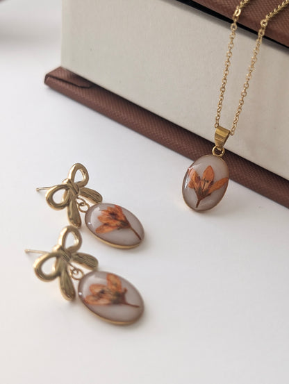 Orange Chloris Virgata Pressed Flora  | Gold Plated Stainless Steel Bow Stud Earrings