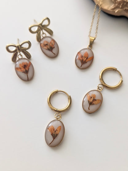 Orange Chloris Virgata Pressed Flora  | Oval Stainless Steel Necklace