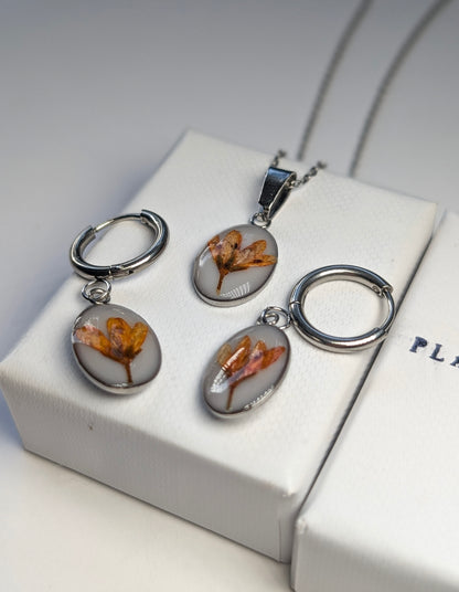 Orange Chloris Virgata Pressed Flora  | Oval Stainless Steel Necklace